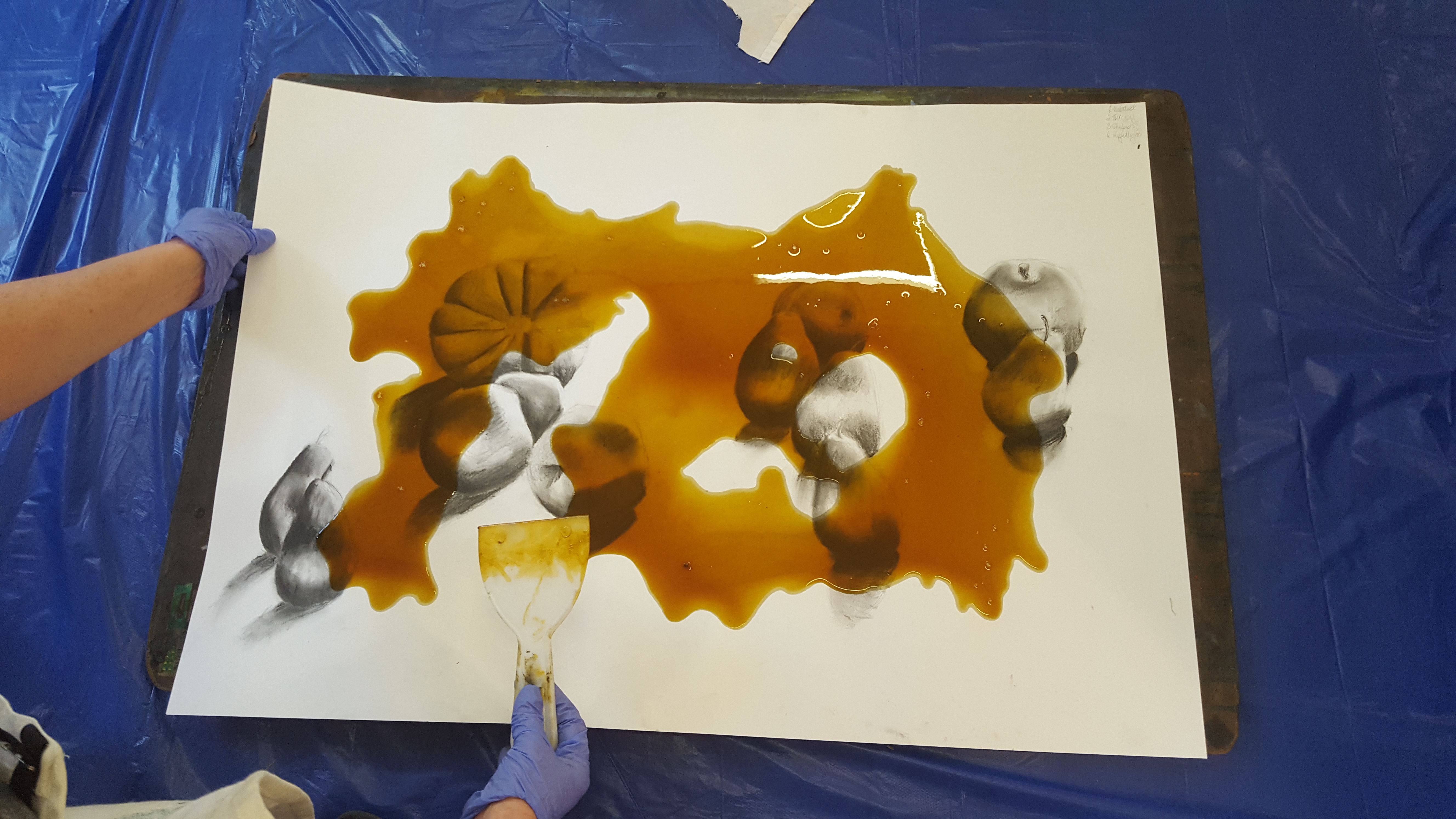 KC smoothing shellac over her drawing